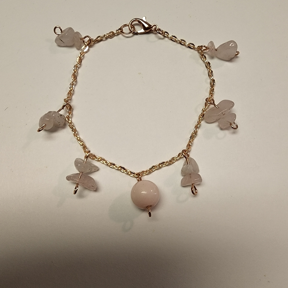 Handmade rose quartz bracelet with rose gold chain.